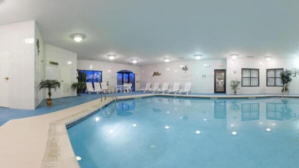 An indoor swimming pool with white lounge chairs and ceiling lights. - Holiday Inn Express Hotel & Suites Easton by IHG (Easton)