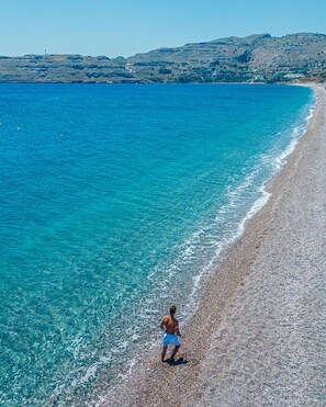 Private beach, free beach shuttle, sun-loungers, beach umbrellas