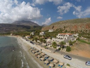 On the beach, sun-loungers, beach umbrellas