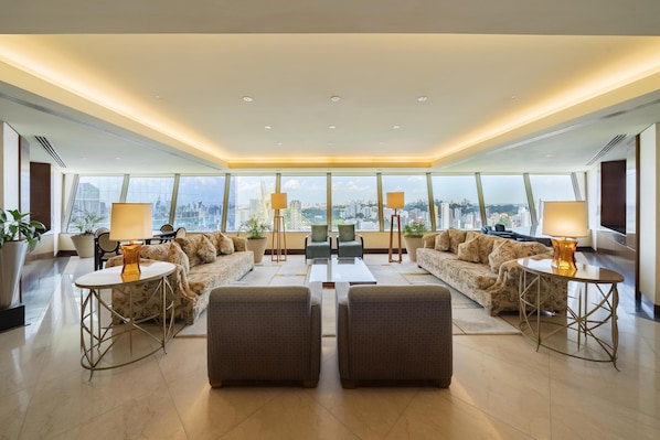 Suite, Club Lounge Access | Living area | 42-inch LCD TV with cable channels, TV