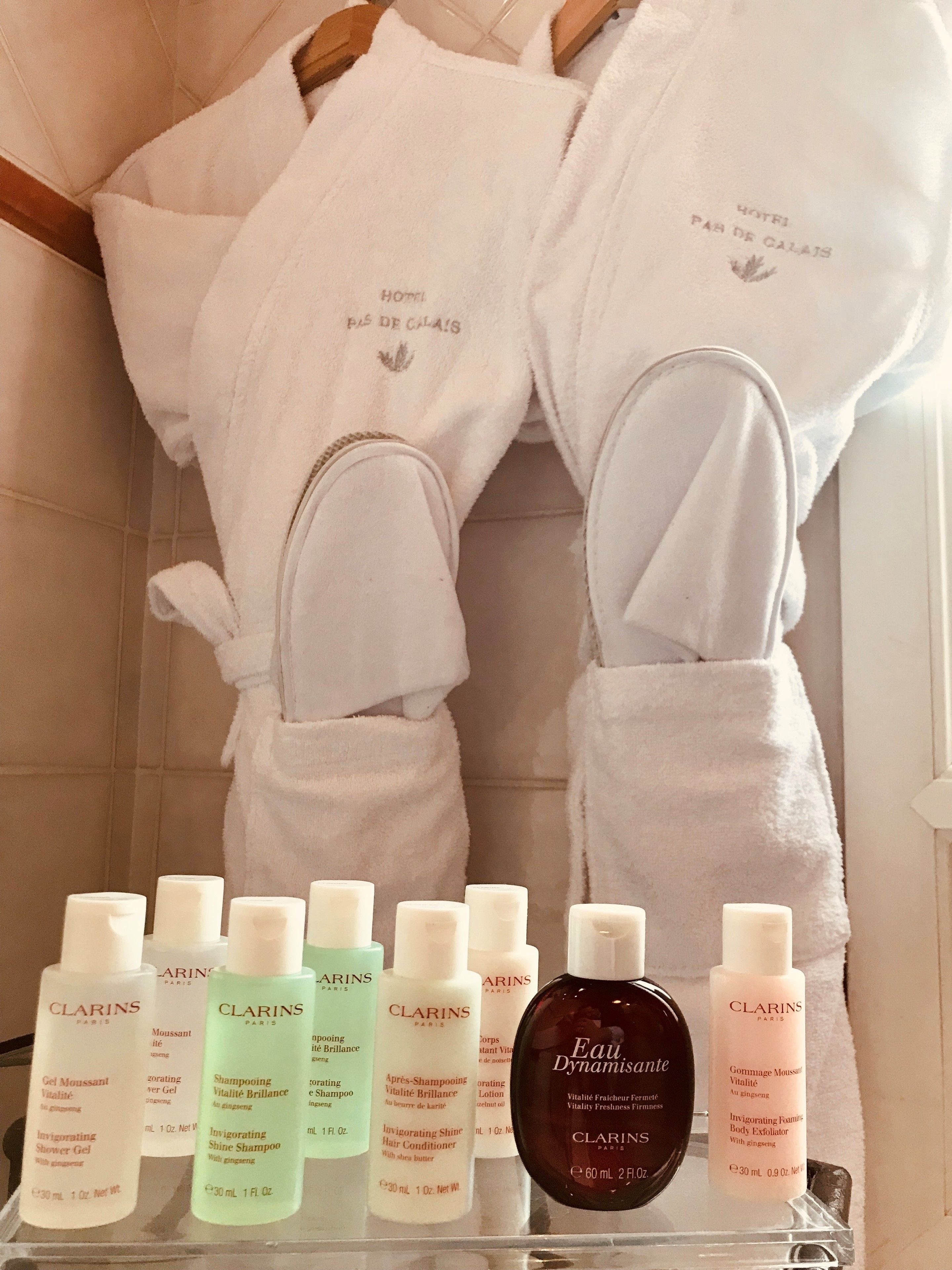 designer toiletries, hair dryer, bathrobes, towels