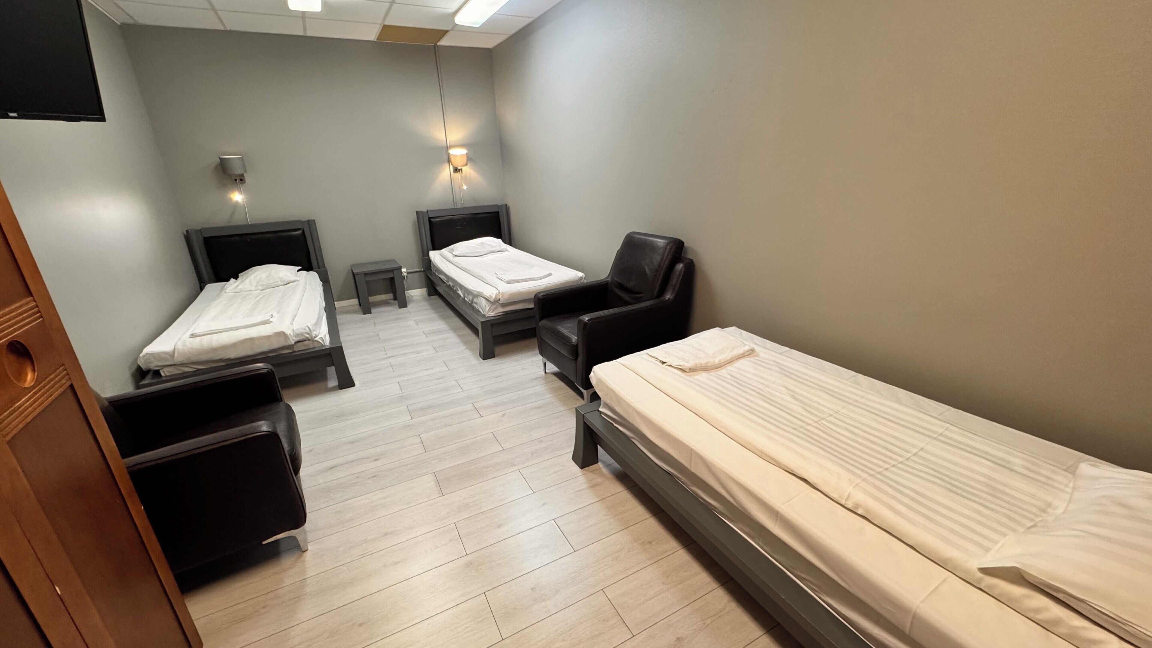 Economy Triple Room, No Windows (Shared Bathroom) | Individually decorated, individually furnished, desk, iron/ironing board