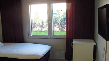 Desk, blackout drapes, iron/ironing board, free cribs/infant beds