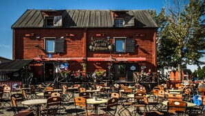 A red wooden building with outdoor seating and a sign reading "Karvila Naravala." - Break Sokos Hotel Eden (Oulu)