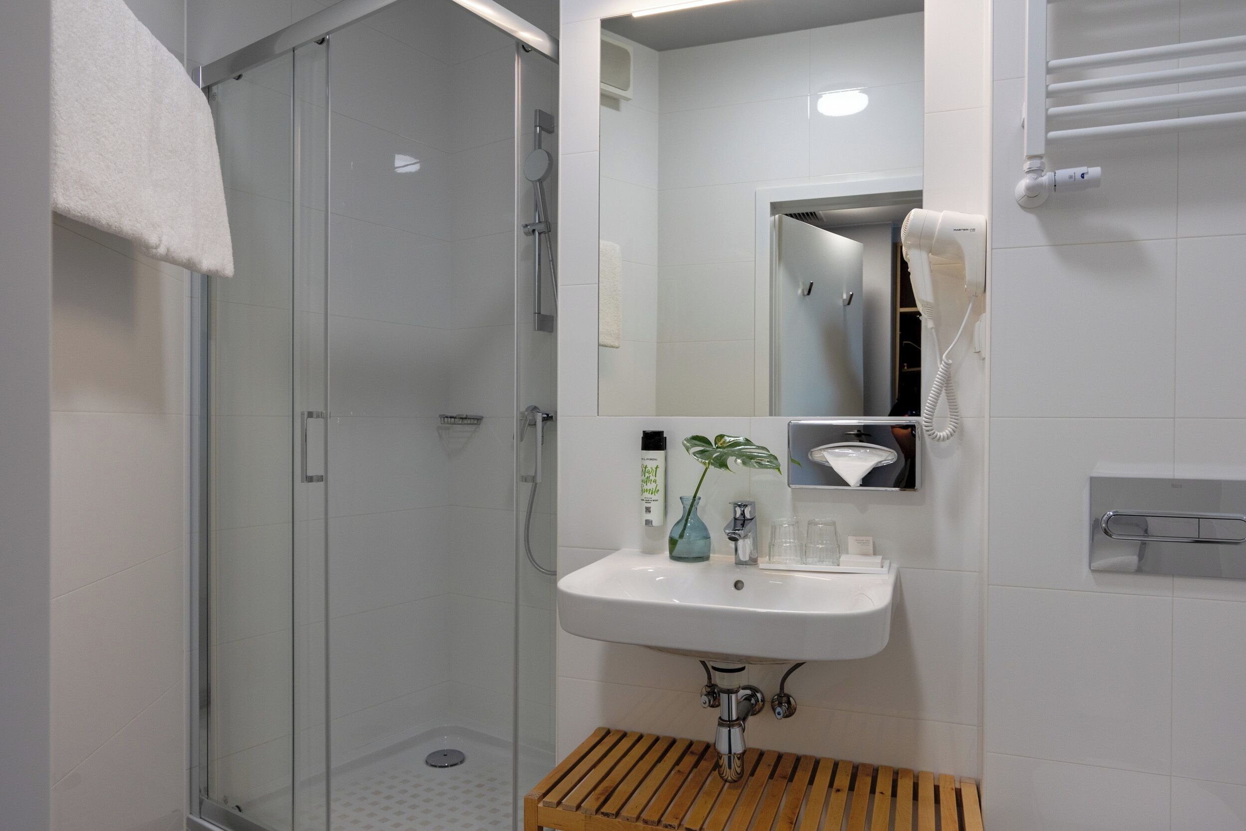 standard double room | bathroom | shower, hair dryer, towels