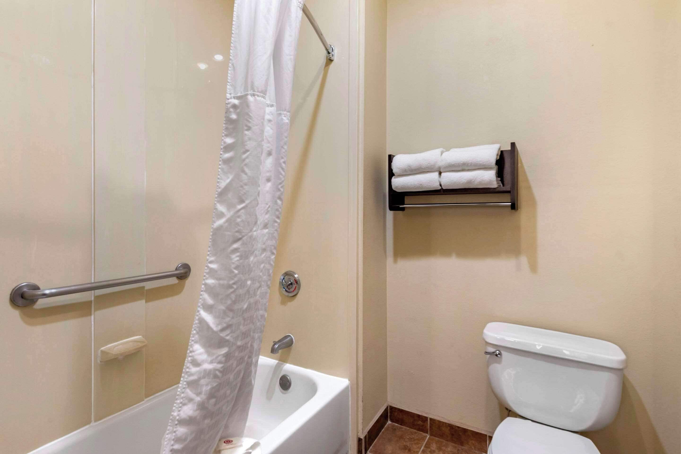 premium bedding, desk, laptop workspace, blackout curtains