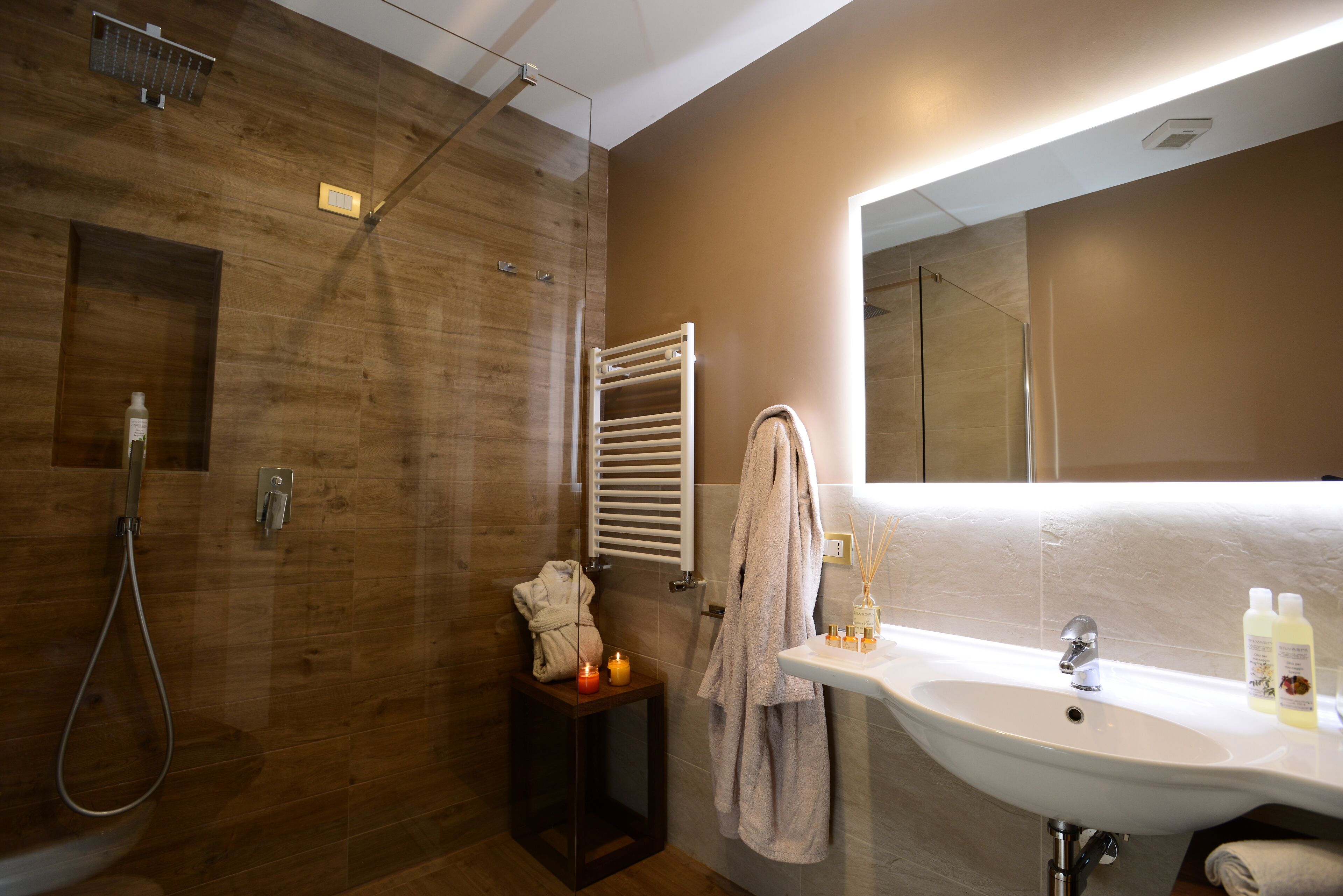 hair dryer, bathrobes, bidet, towels