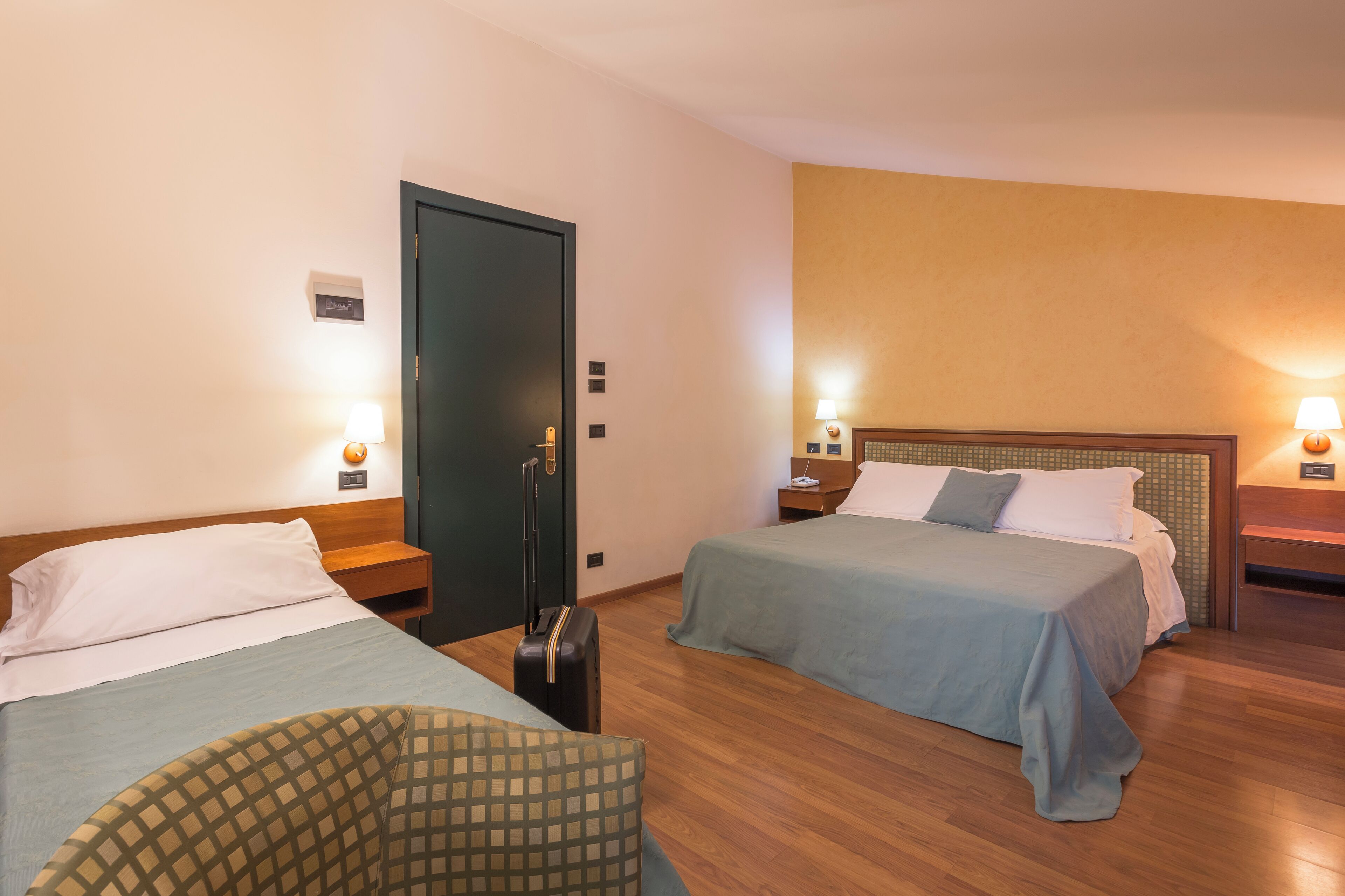 family room | hypo-allergenic bedding, pillow-top beds, minibar, in-room safe