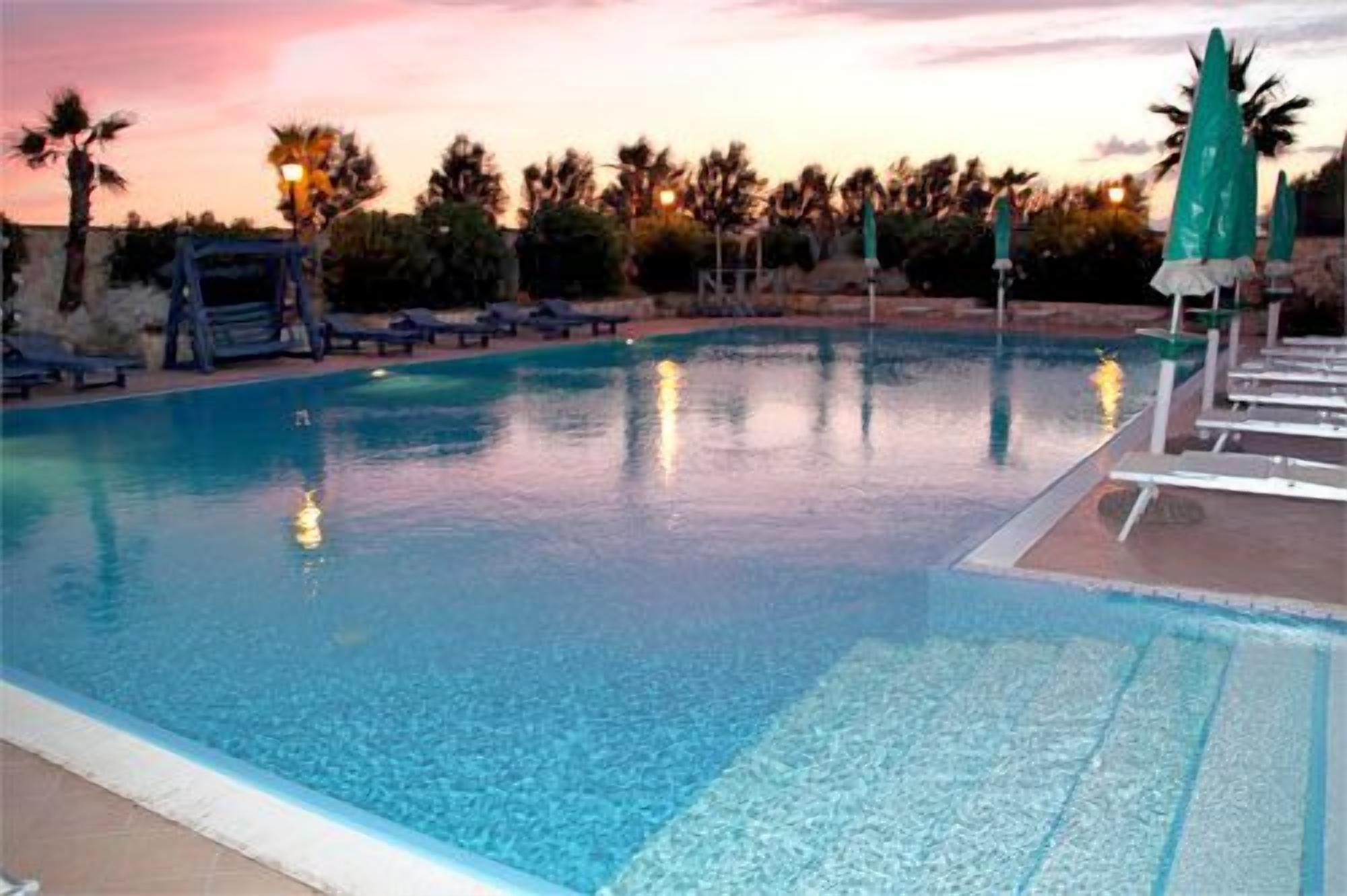 Seasonal outdoor pool, pool umbrellas, pool loungers