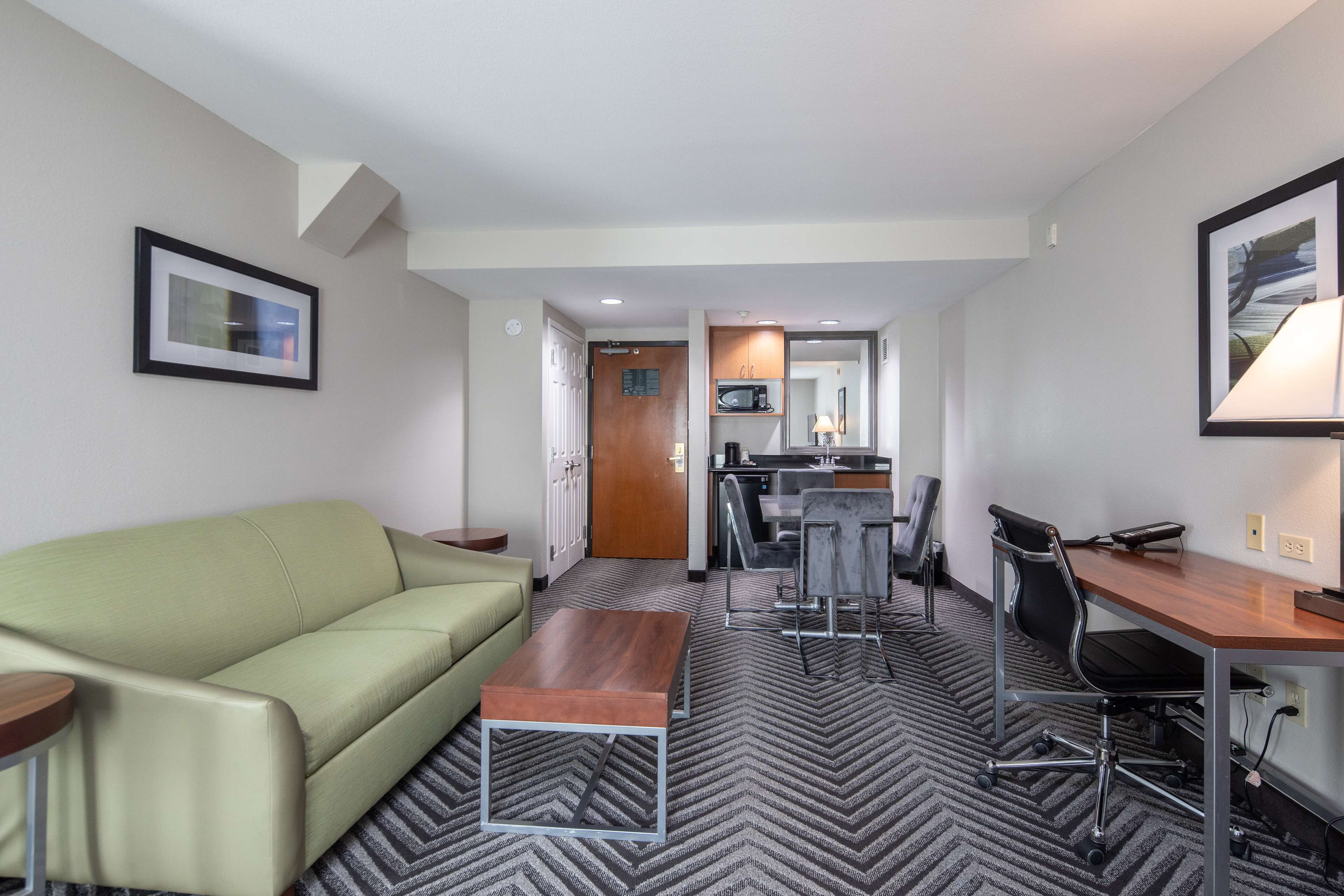 Suite, 1 King Bed, Non Smoking, Microwave | Desk, laptop workspace, blackout drapes, iron/ironing board