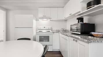 Suite, 2 Queen Beds, Non Smoking, Kitchen (Full Kitchen) | 1 bedroom, laptop workspace, iron/ironing board, cribs/infant beds