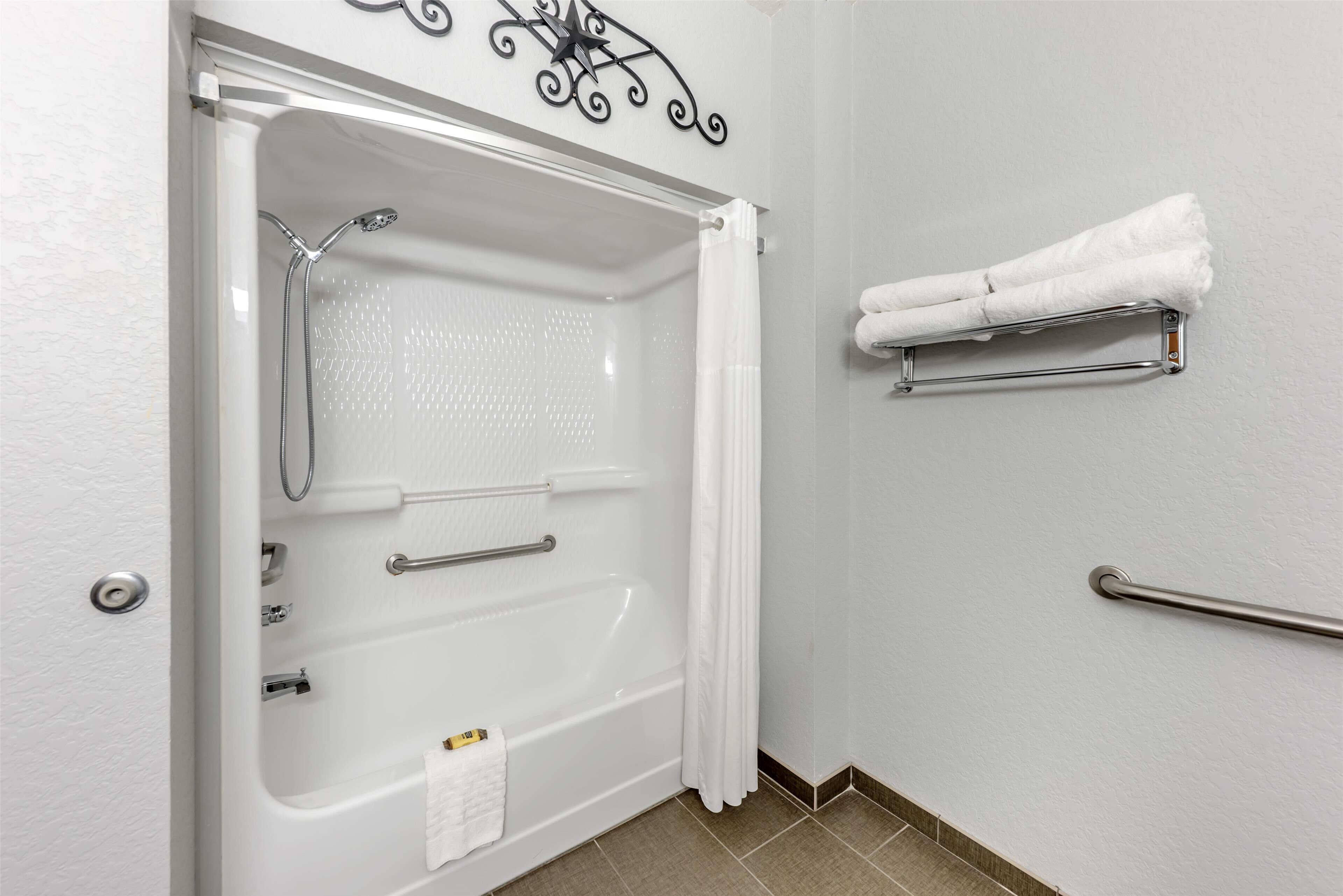 suite, 1 king bed, non smoking, refrigerator & microwave (with sofabed) | bathroom | free toiletries, hair dryer, towels