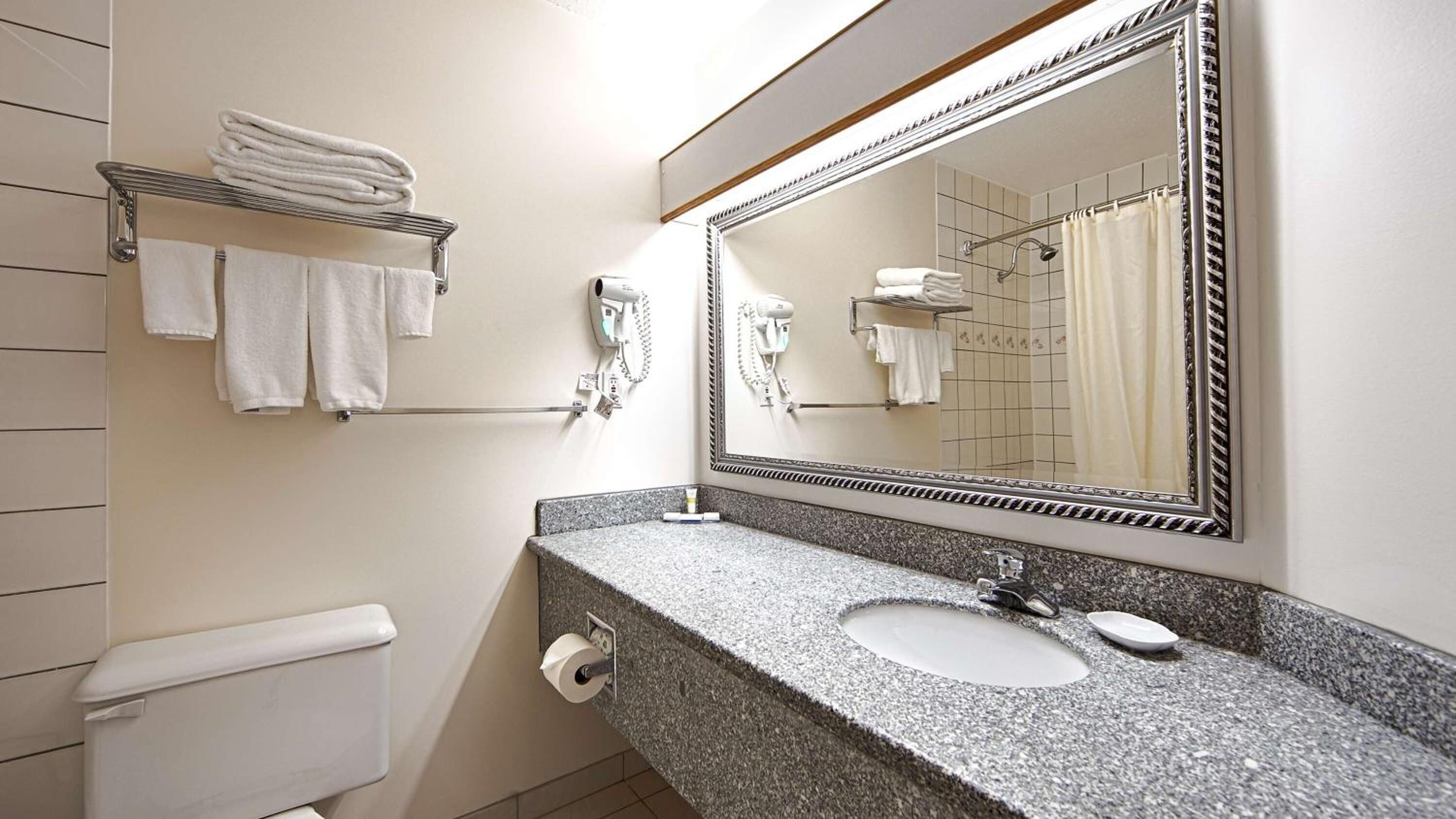 eco-friendly toiletries, hair dryer, towels, soap