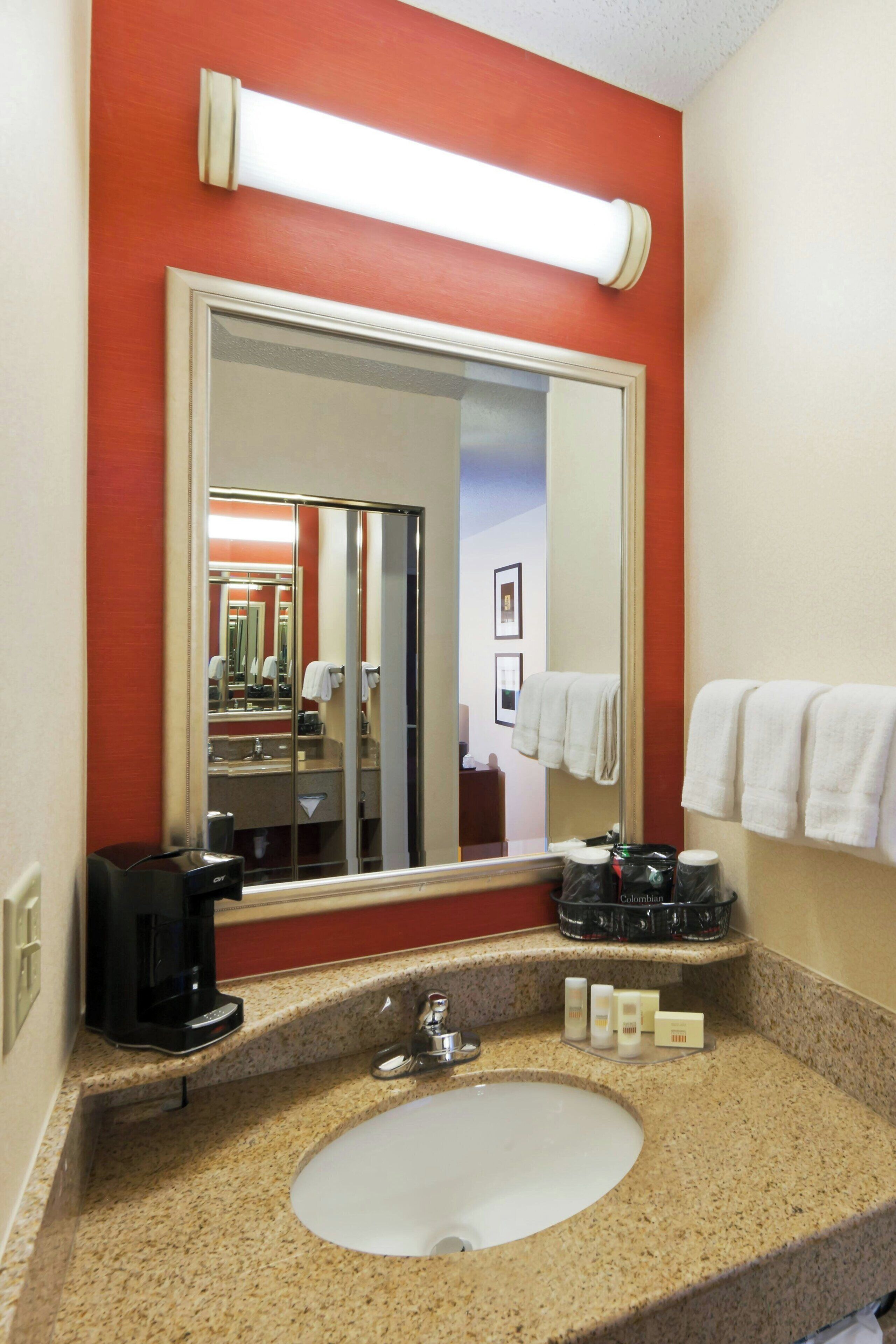 combined shower/bathtub, deep-soaking bathtub, designer toiletries