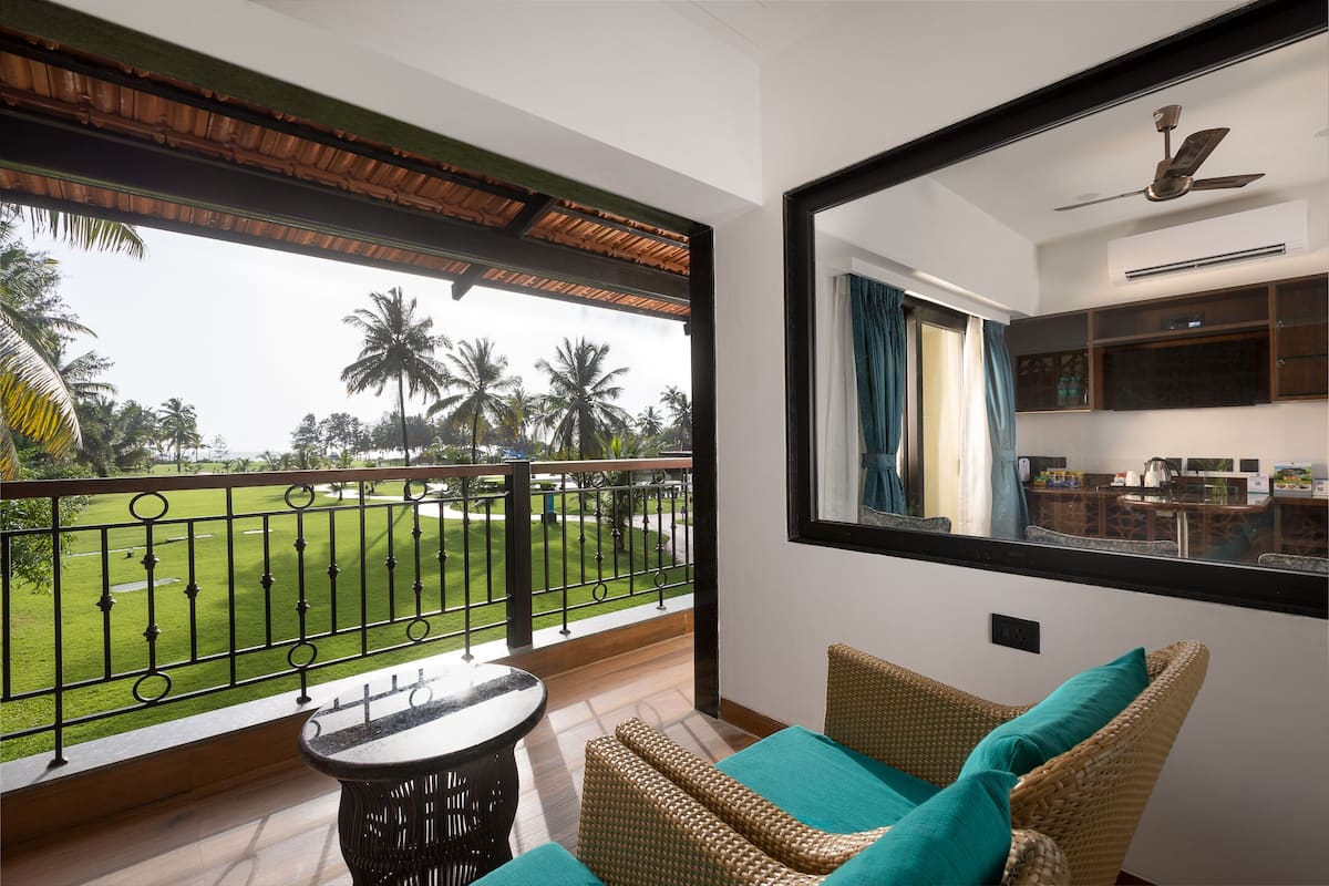 Junior Suite, Pool View | Minibar, in-room safe, desk, laptop workspace