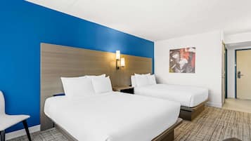 Desk, laptop workspace, blackout drapes, iron/ironing board