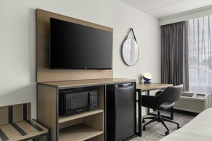 Desk, laptop workspace, blackout drapes, iron/ironing board