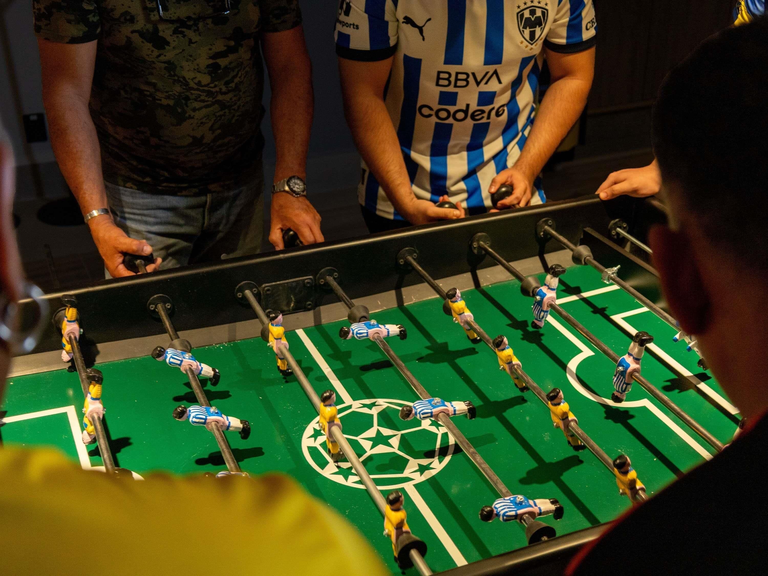 A foosball table with miniature soccer players.