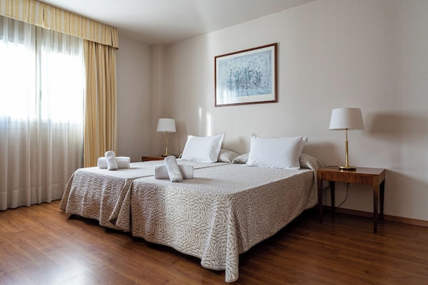 Quadruple Room | Minibar, in-room safe, desk, blackout drapes