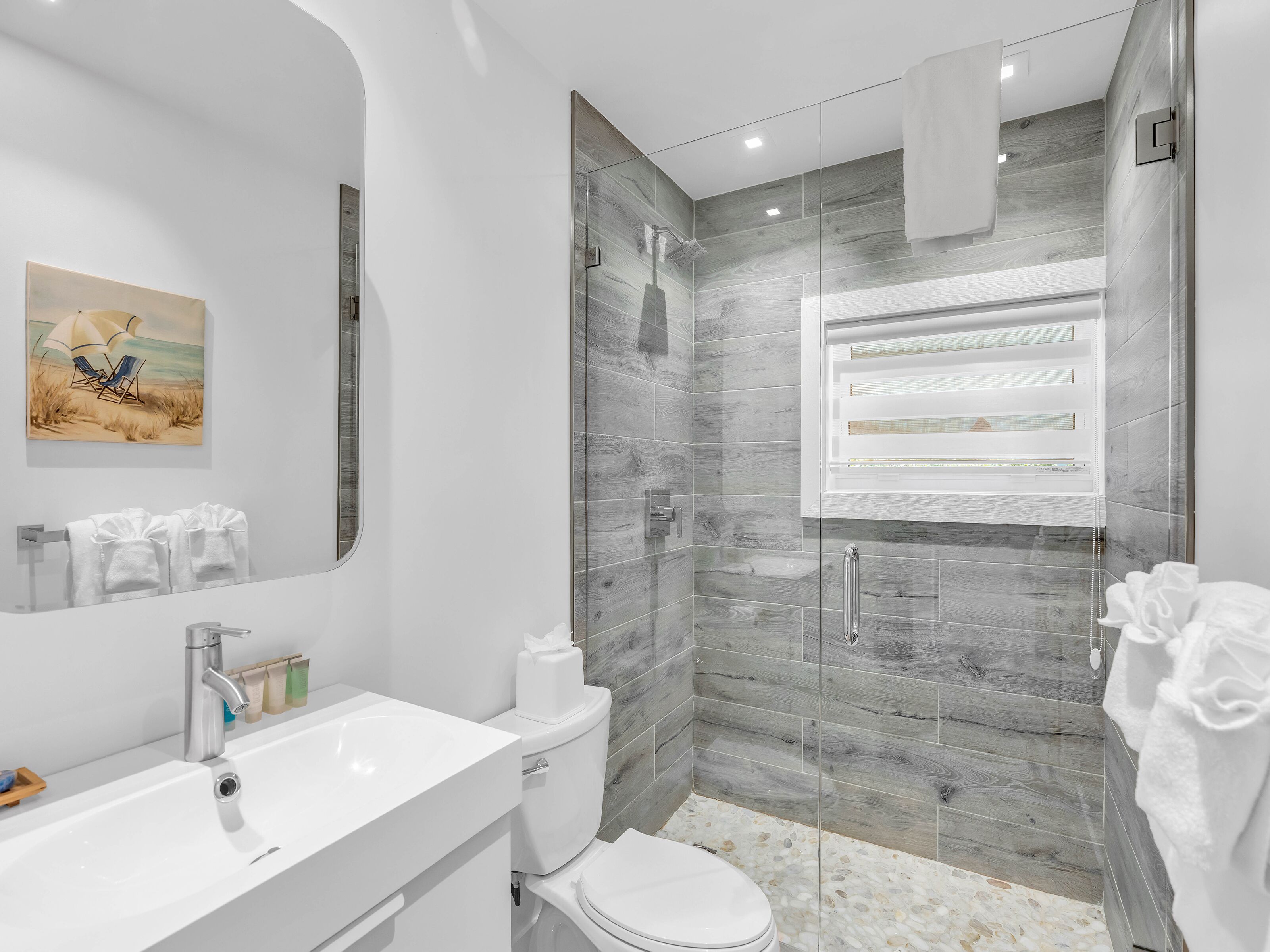 sunset bay suites off main property | bathroom | shower, free toiletries, hair dryer, towels