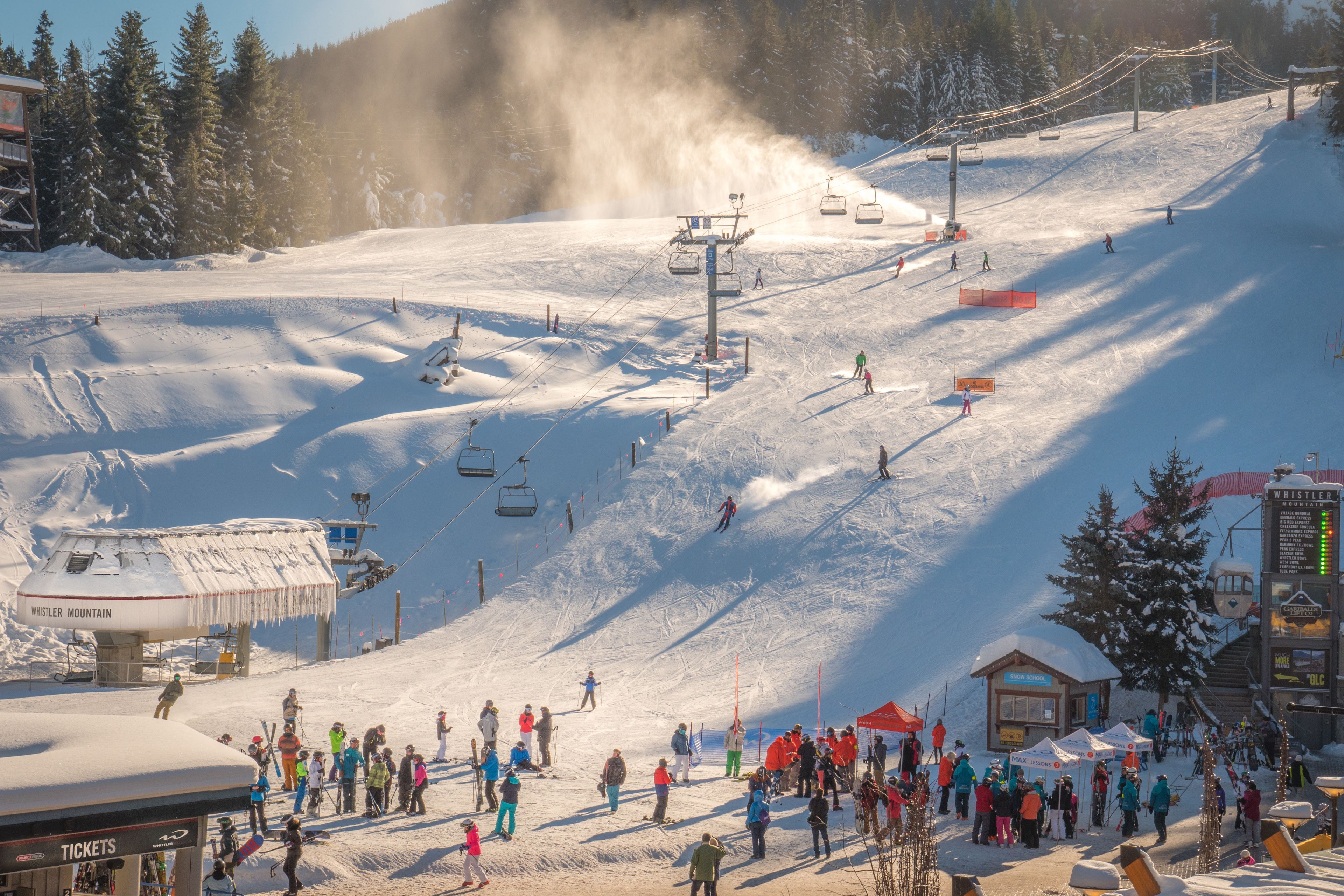 A ski resort with a ski lift, ticket booth, and a building labeled 'Whistler Mountain'.