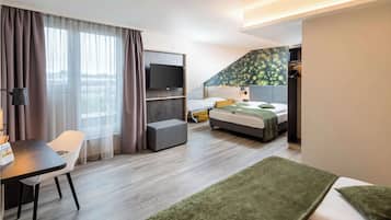 Family Room | Minibar, in-room safe, desk, laptop workspace