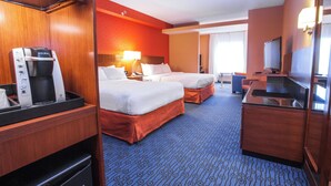 A hotel room with two beds, a minibar, a desk with a television, and a coffee machine. - Fairfield Inn & Suites by Marriott St. John's Newfoundland (St. John's)