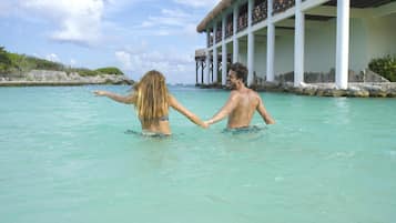 Private beach, white sand, beach towels, beach massages