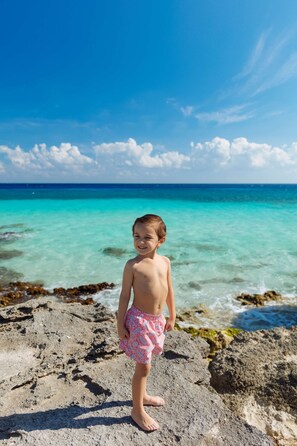 Private beach, white sand, beach towels, beach massages