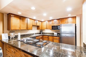 2 Bedroom Condominium with Spa 406 | Private kitchen | Full-size fridge, microwave, oven, stovetop