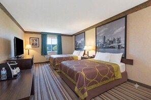A hotel room with two beds, a desk with a television, and a cityscape painting on the wall.