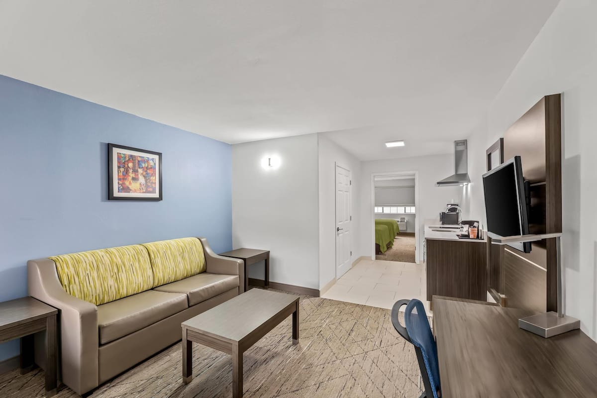 Suite, 2 Queen Beds, Non Smoking | Desk, blackout drapes, iron/ironing board, free cribs/infant beds