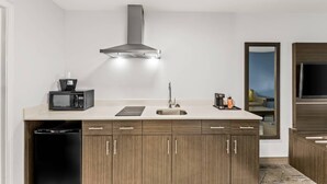 A modern kitchen with a built-in microwave, a sink, and a dishwasher. - Quality Inn & Suites Rio Grande City (Rio Grande City)