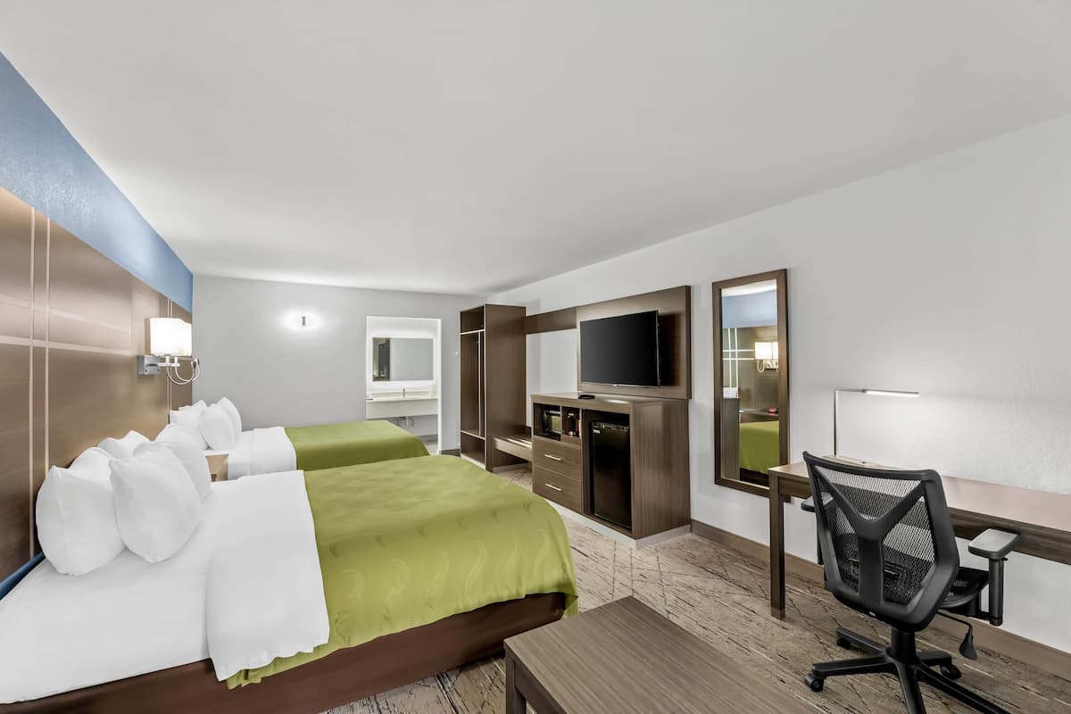 Standard Room, 2 Queen Beds, Non Smoking | Desk, blackout drapes, iron/ironing board, free cribs/infant beds
