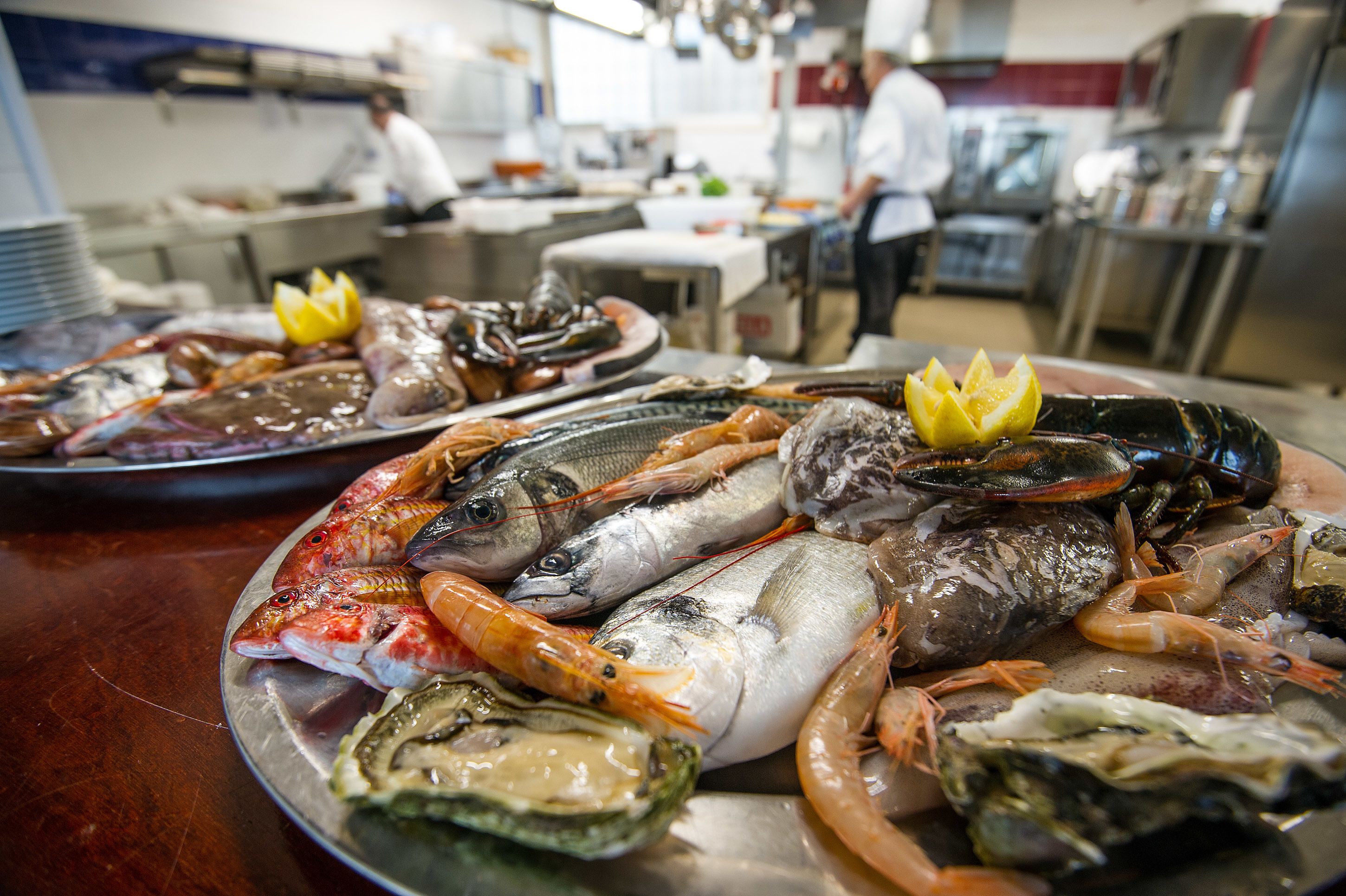 A seafood platter with various types of fish and shellfish.