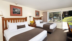 A hotel room with two beds, a large window, and a view of the outside. - Pokolodi Lodge (Snowmass Village)