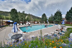 Outdoor pool, open 3:00 PM to 9:00 PM, pool loungers