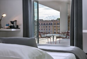 Premium bedding, down comforters, minibar, in-room safe