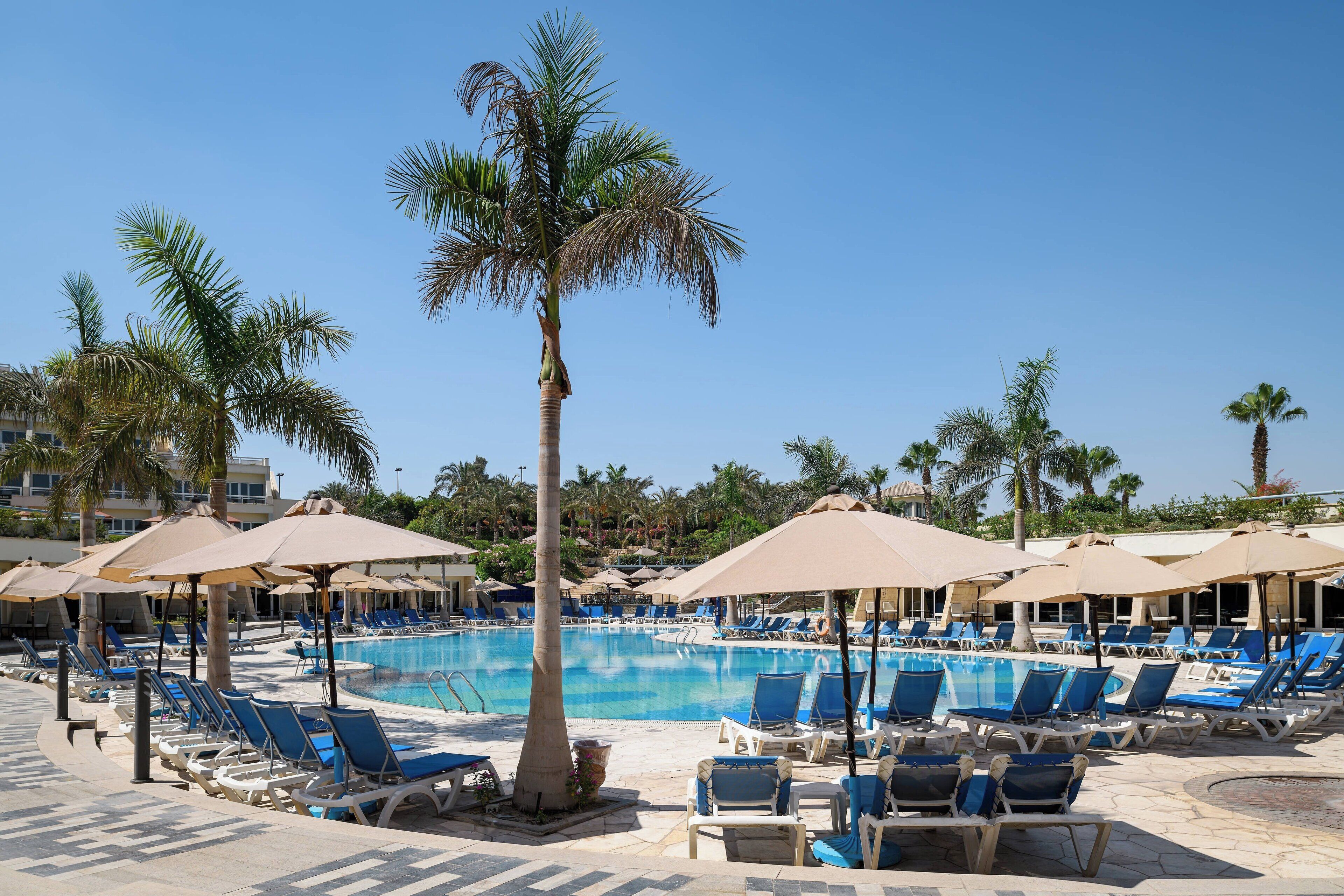 indoor pool, outdoor pool, open 8:00 am to 6:00 pm, pool umbrellas