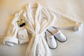 Designer toiletries, hair dryer, bathrobes, slippers