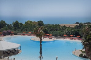 Outdoor pool, pool umbrellas, pool loungers
