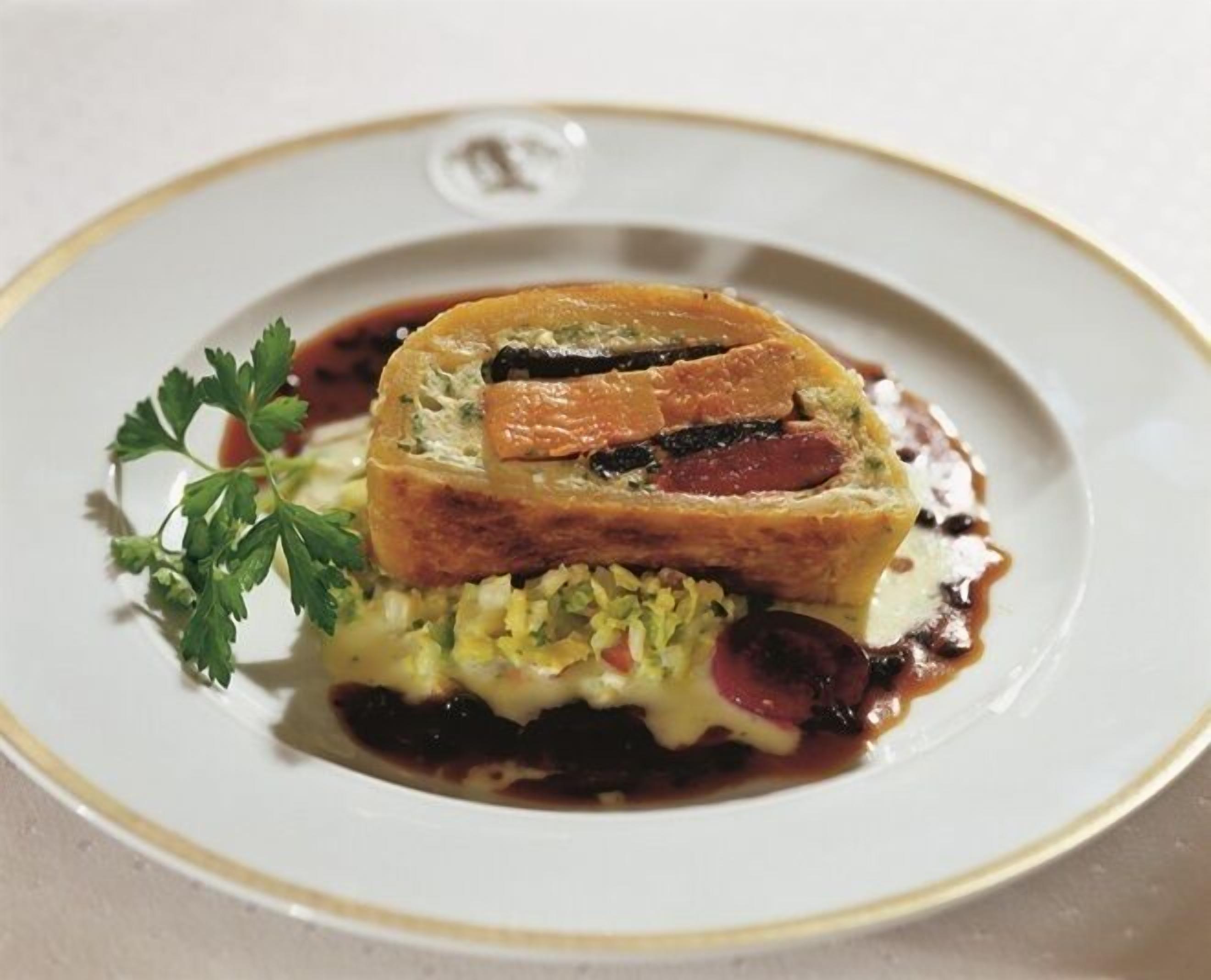 A dish with a pastry on a plate.