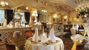 A formal dining room with a round table set for four, surrounded by ornate chairs. - Hotel Jagdhof Glashütte (Bad Laasphe)