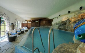 Indoor pool, pool umbrellas, pool loungers