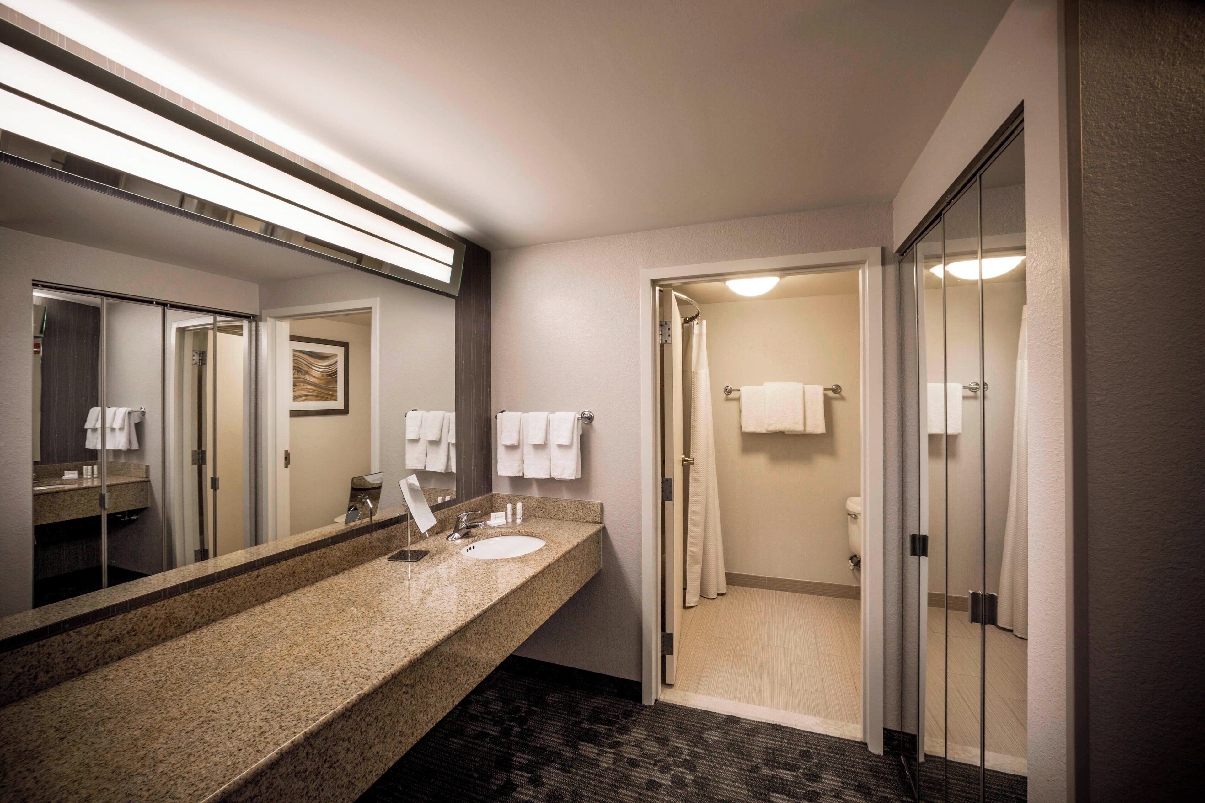 room, 1 king bed (mobility/hearing access, roll-in shwr) | bathroom | combined shower/bathtub, free toiletries, hair dryer, towels