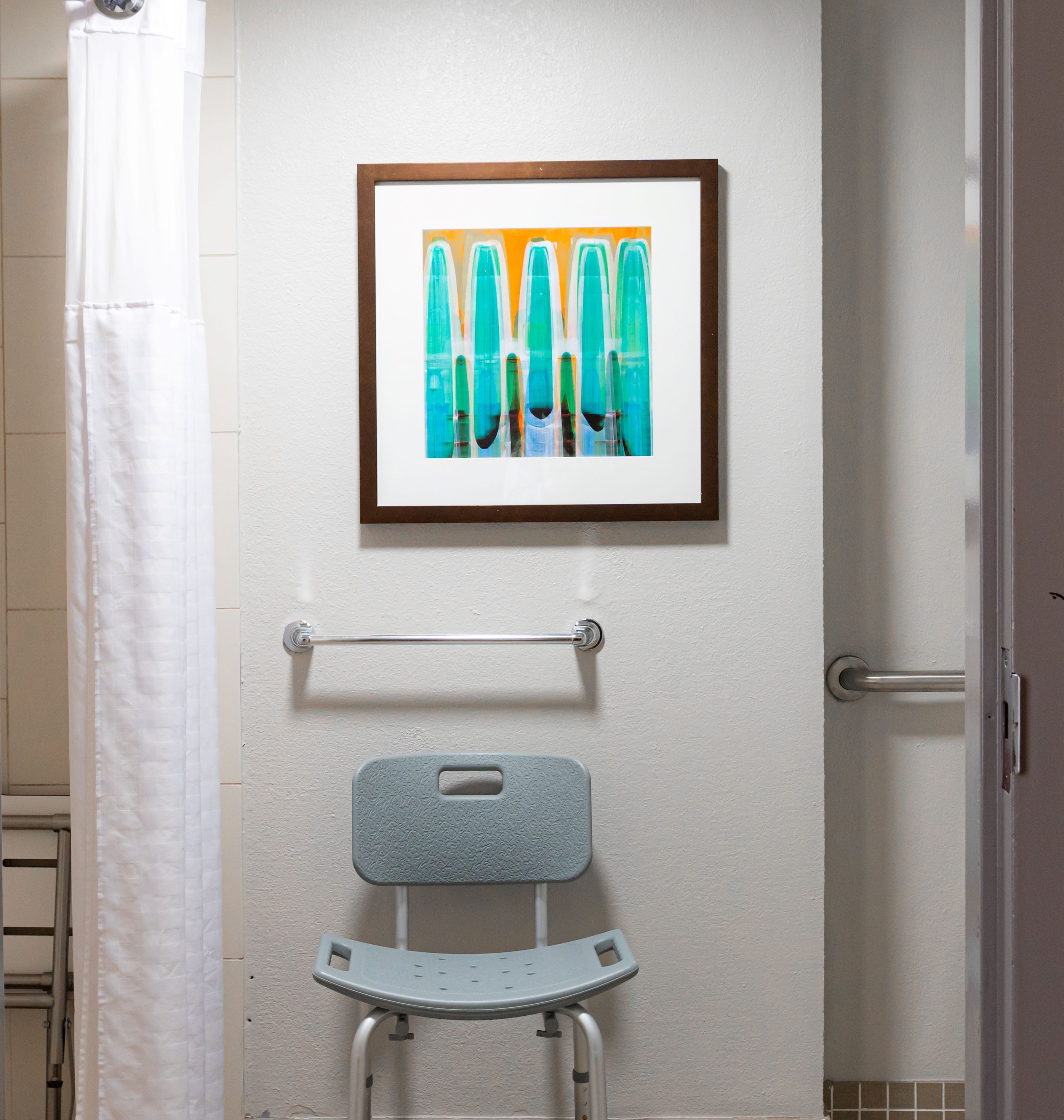 designer toiletries, hair dryer, towels