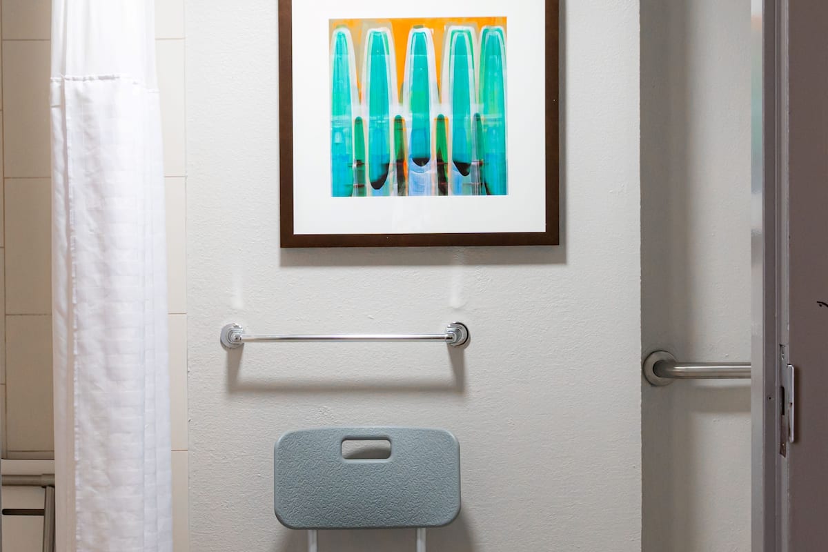 designer toiletries, hair dryer, towels