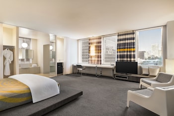 Hotel amenities such as safe, desk and work area at The Delphi Hotel