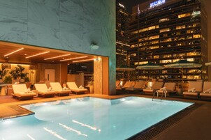 Outdoor pool, open 7:00 AM to 7:00 PM, pool umbrellas, sun loungers