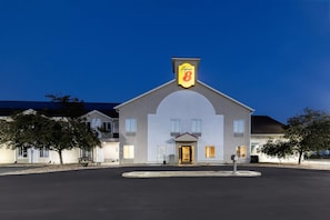 A hotel with a prominent sign reading 'Super 8 by Wyndham' on the facade. - Super 8 by Wyndham Cloverdale IN (Cloverdale)